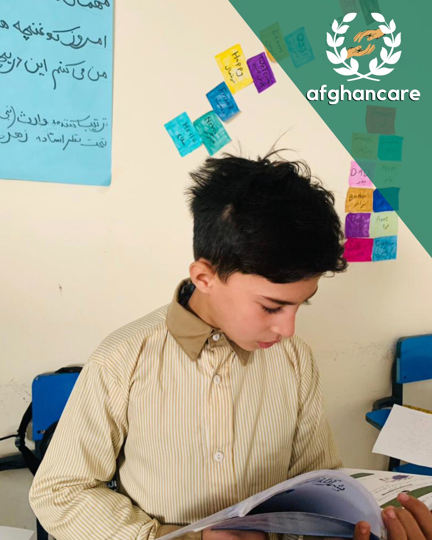 Children receiving educational materials and school supplies in Mazar-i-Sharif classroom