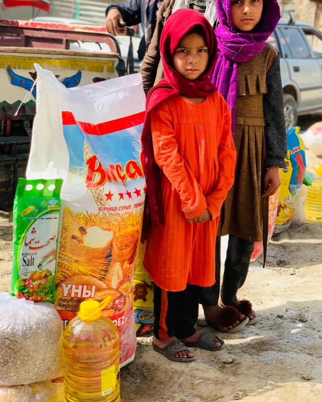 Community members receiving emergency food aid packages in Kandahar Province